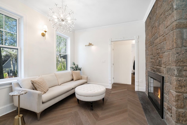 56 Drake Rd, Scarsdale, NY 10583 - living room with ornamental molding, a stone fireplace, a chandelier, and baseboards