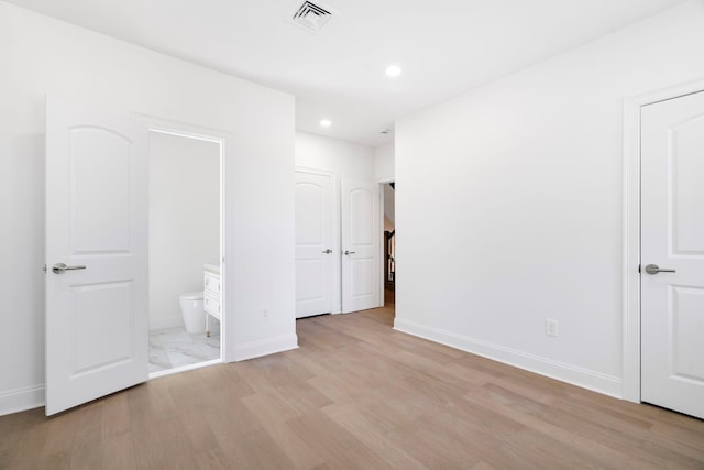 56 Drake Rd, Scarsdale, NY 10583 - unfurnished bedroom featuring light wood-type flooring, recessed lighting, baseboards, and connected bathroom