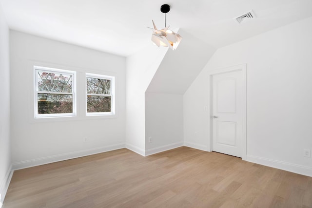 56 Drake Rd, Scarsdale, NY 10583 - bonus room featuring light wood-style flooring, vaulted ceiling, and baseboards