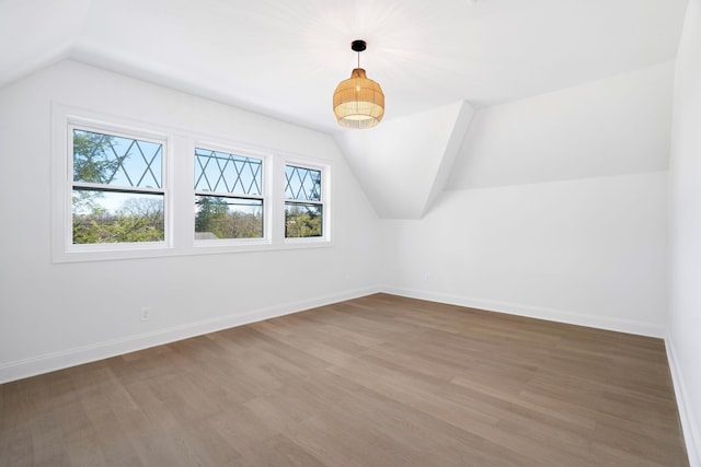 56 Drake Rd, Scarsdale, NY 10583 - bonus room with lofted ceiling, baseboards, and wood finished floors
