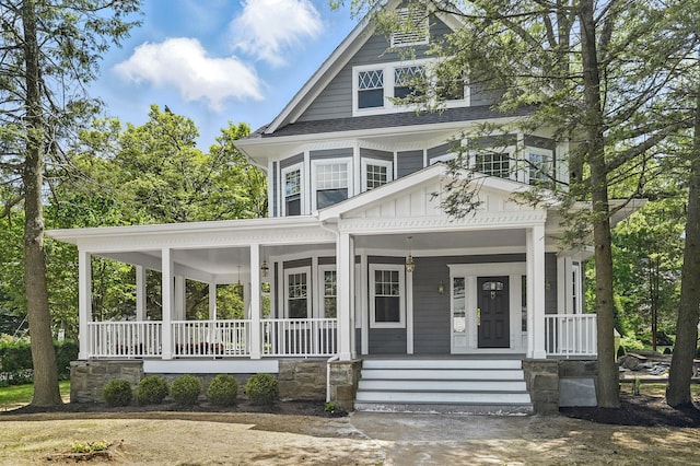 56 Drake Rd, Scarsdale, NY 10583 - view of front of house with board and batten siding and covered porch