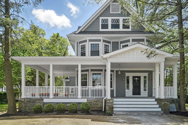 56 Drake Rd, Scarsdale, NY 10583 - view of front of home featuring covered porch, board and batten siding, and roof with shingles