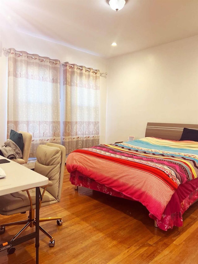 bedroom featuring wood finished floors