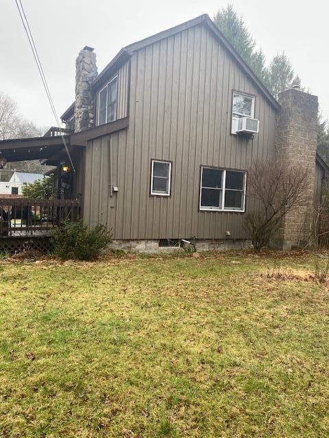 579 State Route 55, Napanoch, NY 12458 - view of property exterior featuring a yard, a wooden deck, cooling unit, and a chimney