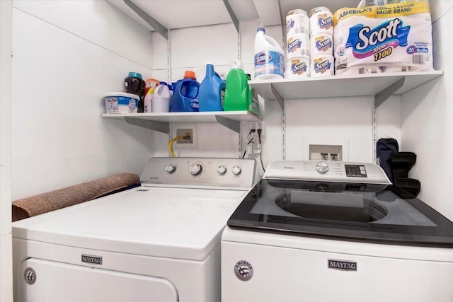 laundry room featuring washing machine and dryer and laundry area