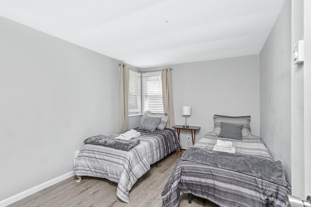 572A Montauk Hwy, Westhampton Beach, NY 11978 - bedroom with baseboards and light wood-style floors