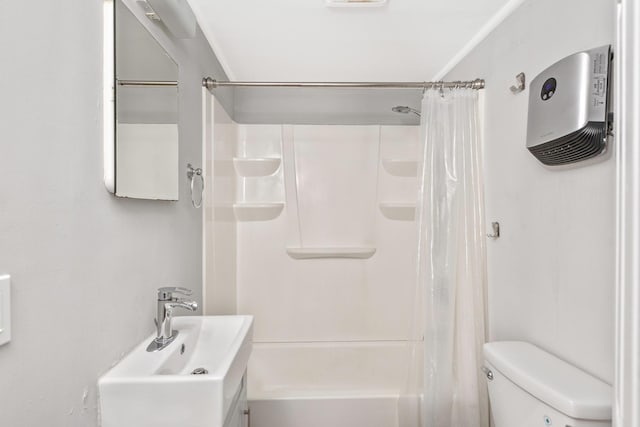 572A Montauk Hwy, Westhampton Beach, NY 11978 - bathroom featuring toilet, a sink, and shower / bath combo with shower curtain