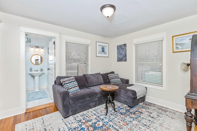 572A Montauk Hwy, Westhampton Beach, NY 11978 - living room featuring wood finished floors and baseboards
