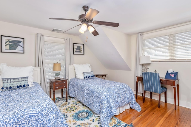 572A Montauk Hwy, Westhampton Beach, NY 11978 - bedroom with wood finished floors, ceiling fan, baseboards, lofted ceiling, and visible vents