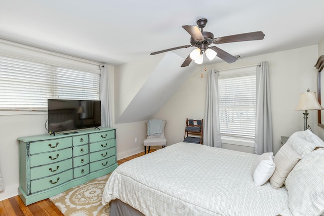 572A Montauk Hwy, Westhampton Beach, NY 11978 - bedroom featuring vaulted ceiling, wood finished floors, baseboards, and ceiling fan