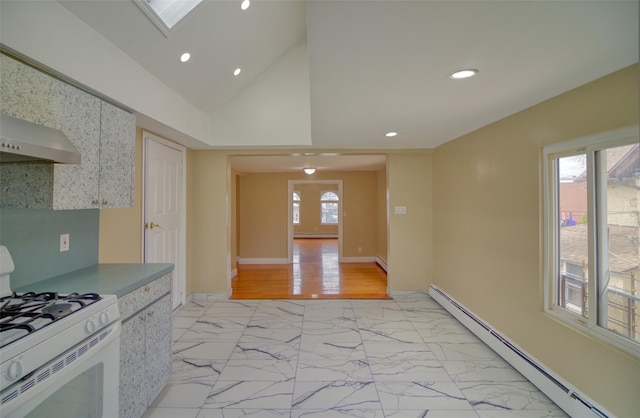 kitchen featuring white gas range oven, recessed lighting, marble finish floor, a baseboard radiator, and baseboards