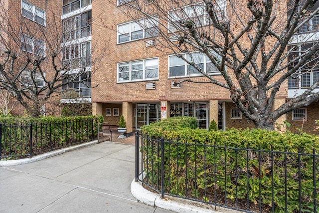 90-59 56th Ave Unit 2J, Elmhurst, NY 11373 - view of front of home featuring fence private yard and brick siding