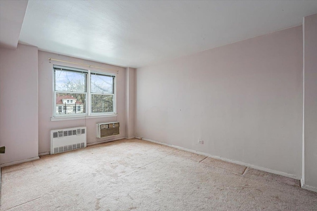 90-59 56th Ave Unit 2J, Elmhurst, NY 11373 - carpeted spare room with baseboards and radiator heating unit
