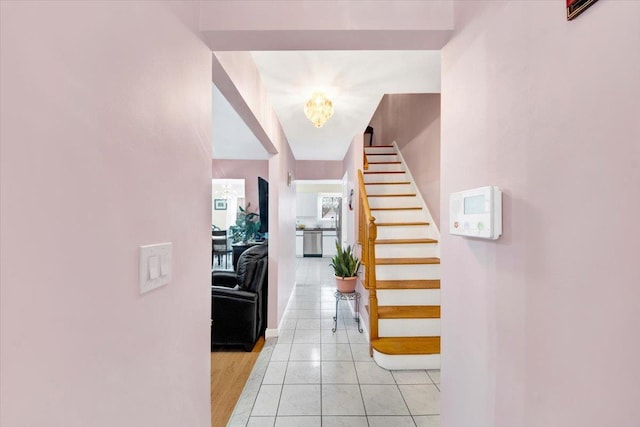 2559 Seymour Ave, Bronx, NY 10469 - entrance foyer featuring baseboards, a notable chandelier, stairs, and light tile patterned flooring