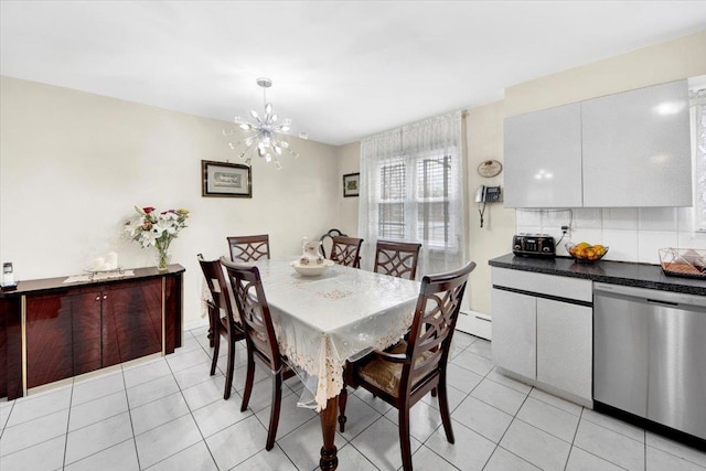 2559 Seymour Ave, Bronx, NY 10469 - dining area with a baseboard radiator, light tile patterned flooring, and an inviting chandelier