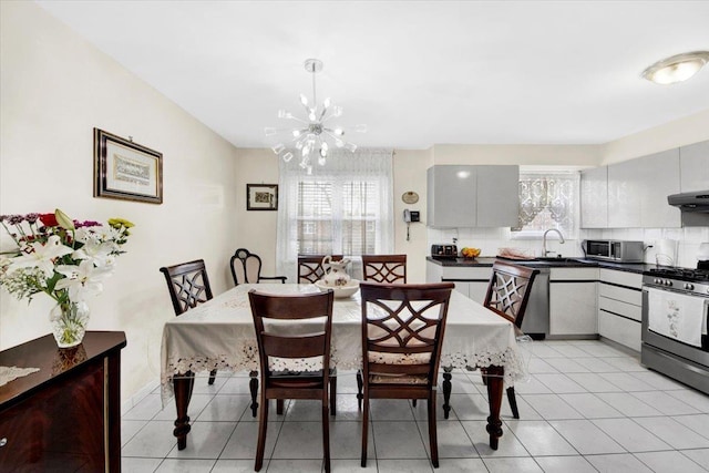 2559 Seymour Ave, Bronx, NY 10469 - dining space with an inviting chandelier and light tile patterned floors