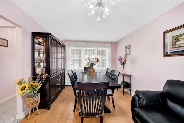 2559 Seymour Ave, Bronx, NY 10469 - dining area with baseboard heating, baseboards, an inviting chandelier, and light wood-type flooring
