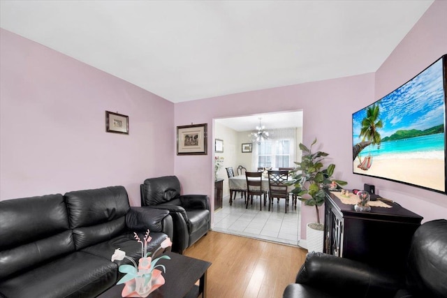 2559 Seymour Ave, Bronx, NY 10469 - living room with a chandelier and light wood finished floors