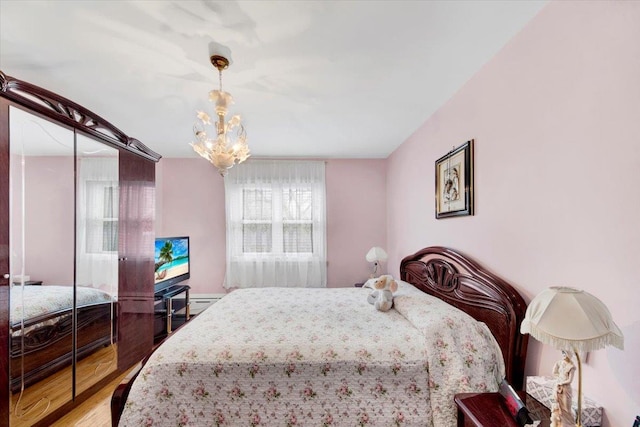 2559 Seymour Ave, Bronx, NY 10469 - bedroom with wood finished floors and a notable chandelier