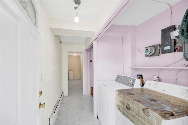 2559 Seymour Ave, Bronx, NY 10469 - clothes washing area with baseboard heating, marble finish floor, washer and clothes dryer, and laundry area
