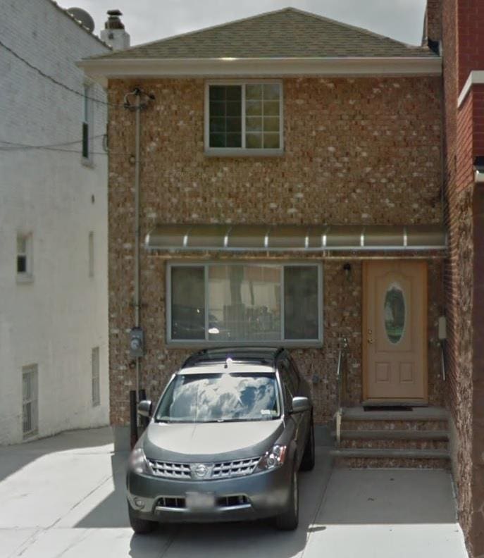 1933 Colden Ave, Bronx, NY 10462 - view of front of property with brick siding, entry steps, roof with shingles, and a chimney