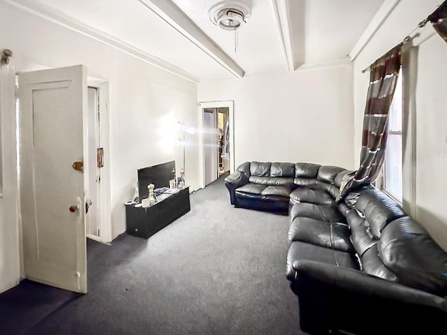 carpeted living room featuring beam ceiling