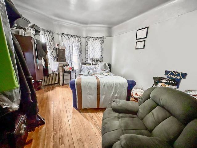 bedroom with wood-type flooring
