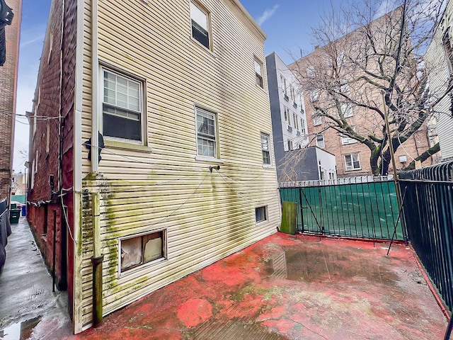view of property exterior with fence