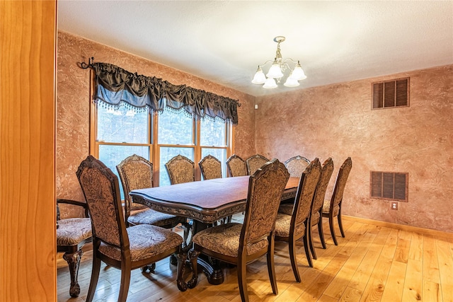 26 Cowboy Trl, Saugerties, NY 12477 - dining space featuring a chandelier, light wood finished floors, baseboards, and visible vents