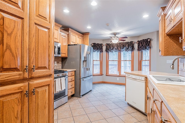 26 Cowboy Trl, Saugerties, NY 12477 - kitchen featuring a sink, light countertops, appliances with stainless steel finishes, and ceiling fan