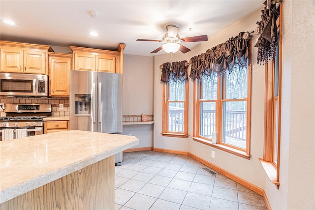 26 Cowboy Trl, Saugerties, NY 12477 - kitchen with visible vents, light brown cabinets, appliances with stainless steel finishes, backsplash, and light tile patterned flooring