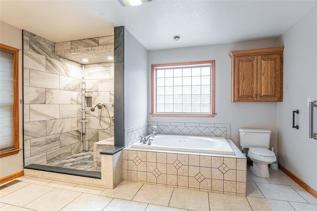 26 Cowboy Trl, Saugerties, NY 12477 - full bathroom featuring baseboards, toilet, tile patterned floors, a stall shower, and a garden tub