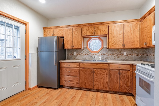 26 Cowboy Trl, Saugerties, NY 12477 - kitchen with light countertops, a healthy amount of sunlight, a sink, and white appliances
