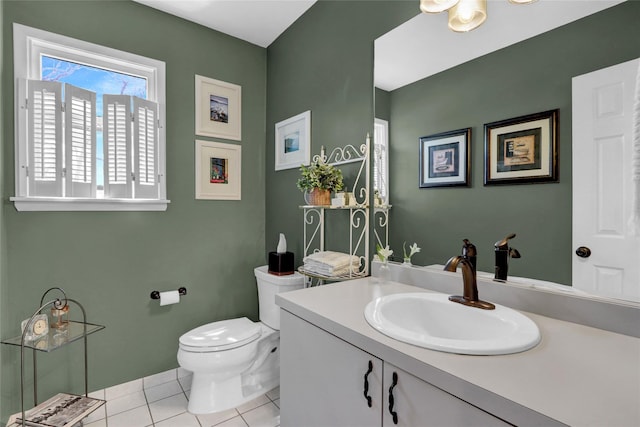 bathroom featuring tile patterned floors, vanity, and toilet