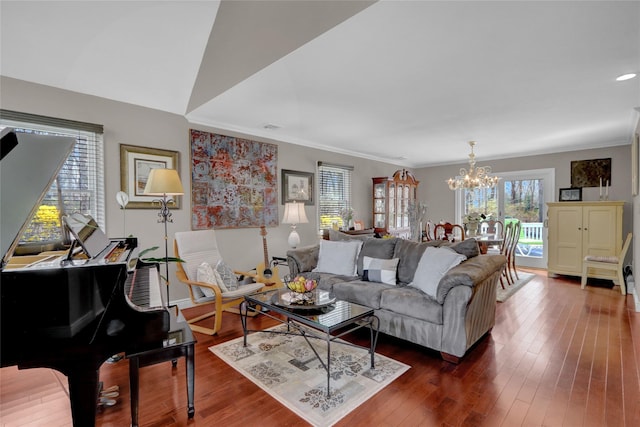 living area with recessed lighting, dark wood-type flooring, crown molding, baseboards, and a notable chandelier
