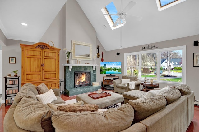 living room with a skylight, wood finished floors, and high vaulted ceiling