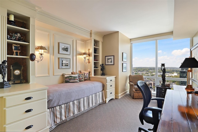 carpeted bedroom with baseboards and expansive windows