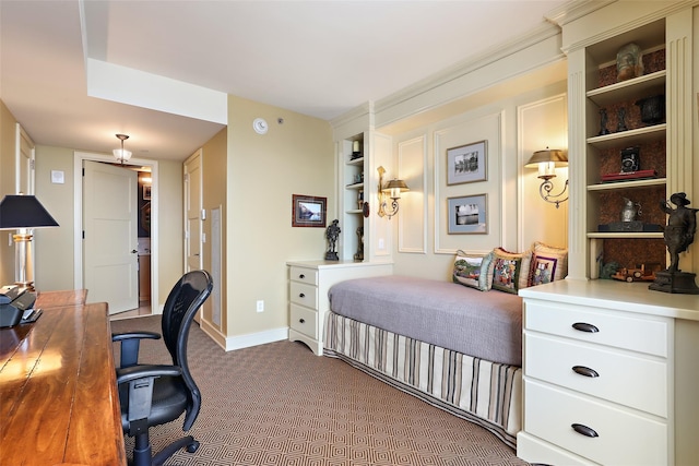 bedroom featuring baseboards and dark carpet