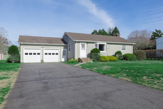ranch-style house with a garage, driveway, a shingled roof, and a front yard