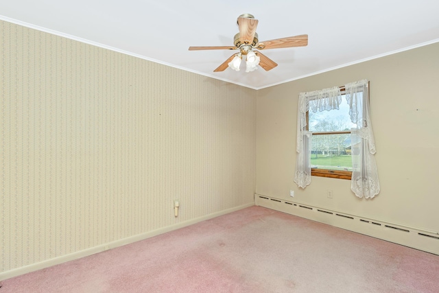 carpeted spare room with a baseboard heating unit, ceiling fan, and ornamental molding