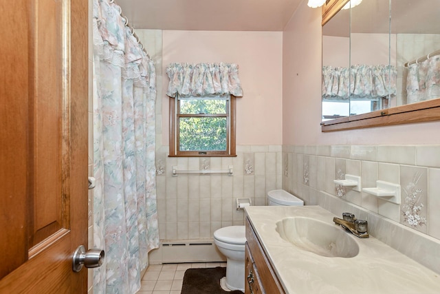 bathroom with a baseboard heating unit, vanity, a shower with curtain, toilet, and tile patterned flooring