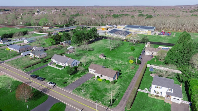 birds eye view of property featuring a wooded view