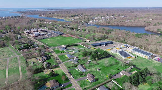 aerial view with a view of trees and a water view