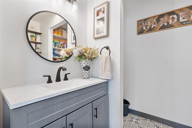 bathroom with baseboards and vanity