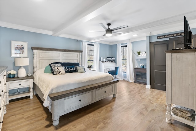 bedroom with light wood finished floors, a ceiling fan, beam ceiling, and crown molding