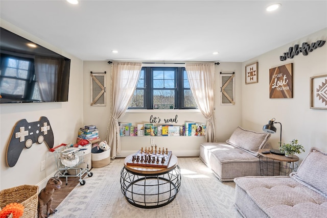living room with recessed lighting, wood finished floors, and baseboards