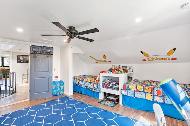 bedroom featuring baseboards, recessed lighting, lofted ceiling, wood finished floors, and ceiling fan