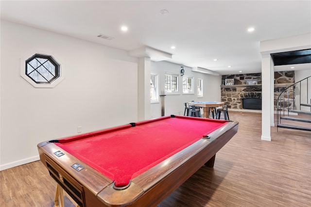 playroom featuring billiards, wood finished floors, visible vents, baseboards, and a fireplace