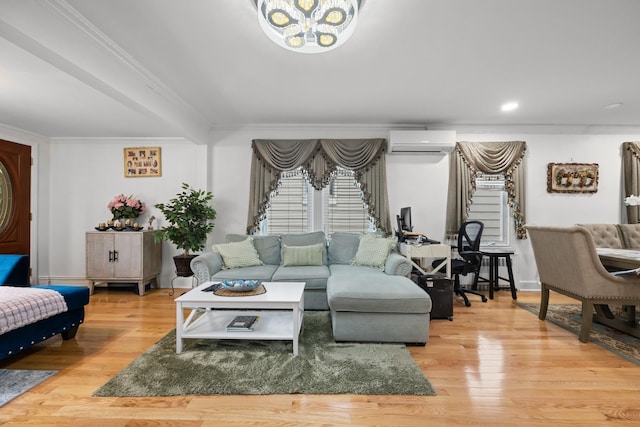 living area featuring a notable chandelier, crown molding, stairway, wood finished floors, and a wall unit AC