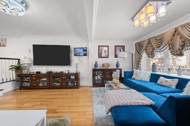 living room featuring wood finished floors, beamed ceiling, and ornamental molding
